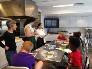 Meghan Filoromo (center) explains where to find seasonal produce and how to qualify for the Philly Food Bucks program.