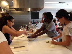 Sophia (left), Landry (center) and Olivia (right) get right into chopping the vegetables for the egg dishes.