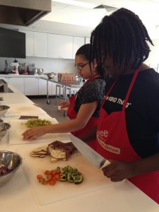 The little chefs finish cutting up all the yummy pizza toppings.